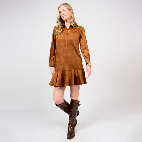 Woman wearing a brown suede dress with a white background