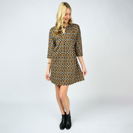 Woman wearing a patterned dress on a white background