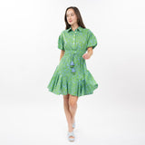 Woman wearing a green dress with a white background