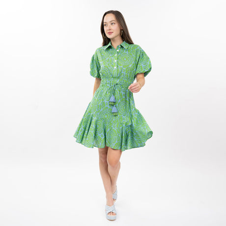 Woman wearing a green dress with a white background