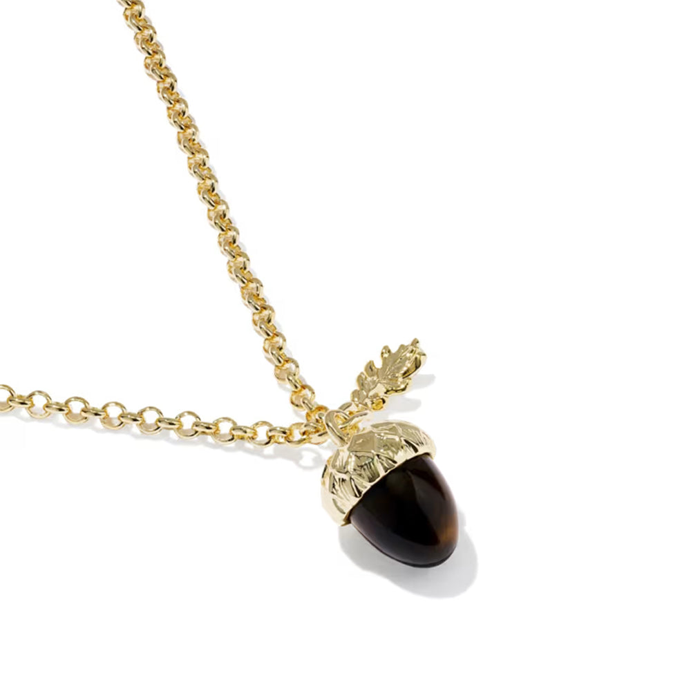 A gold acorn pendant necklace with a glossy dark brown to black stone center, shown on a clean white background.
