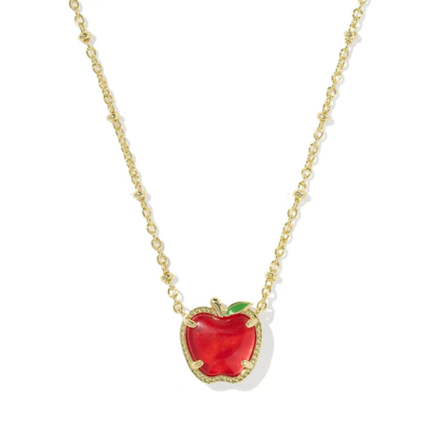 A gold chain necklace featuring a heart-shaped red apple pendant with a gold border and a small green leaf accent, shown on a plain white background.
