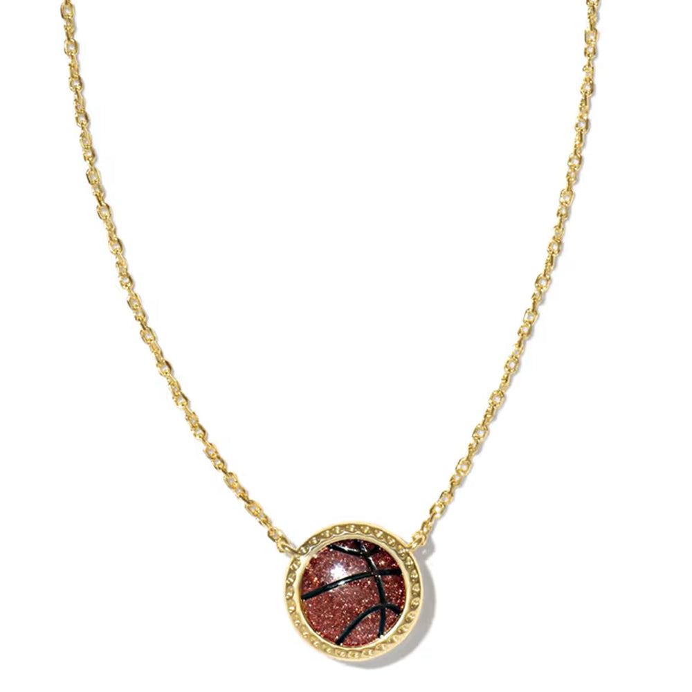 A delicate gold chain necklace with a small oval pendant featuring a reddish-brown stone surrounded by a gold border, displayed on a clean white background.