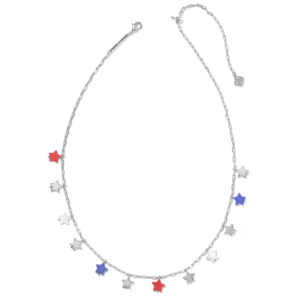 A silver-toned chain necklace with multiple dangling star charms, including three red stars and two blue stars on a plain white background.