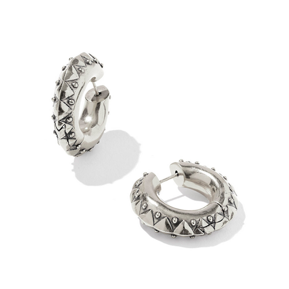 Silver hoop earrings with pyramid designs on a white background