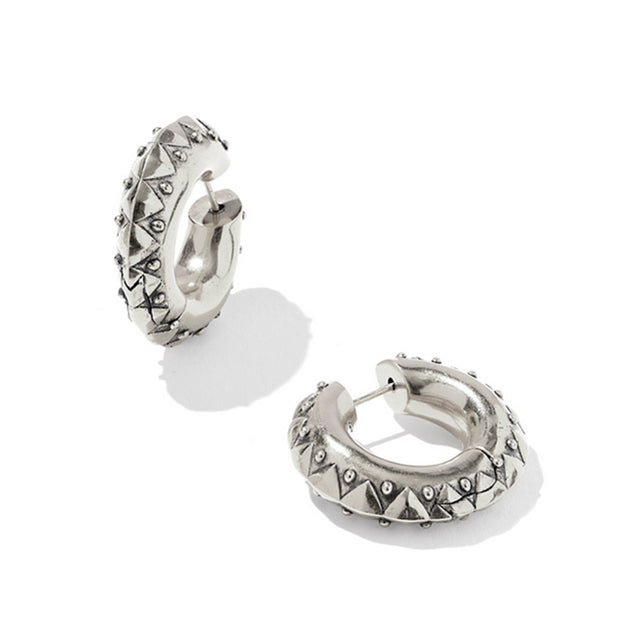 Silver hoop earrings with pyramid designs on a white background