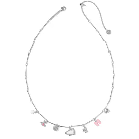 A silver beaded necklace with small dangling charms, including a pink flamingo, a pink heart, a silver moon, and a silver heart, displayed on a clean white background.