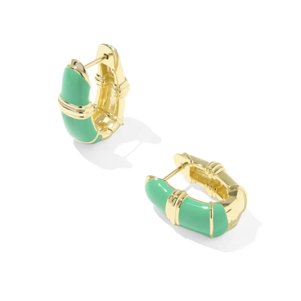 A pair of gold huggie hoop earrings with curved mint green enamel inlays, shown on a clean white background.