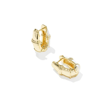 A pair of gold huggie hoop earrings with a textured, geometric bamboo-inspired design, shown on a clean white background.