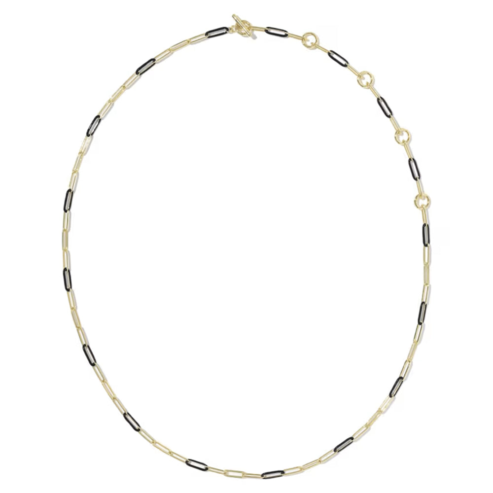 A delicate gold chain necklace featuring alternating small gold oval links and black oval links, displayed on a clean white background.