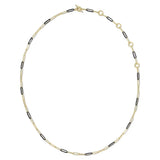 A delicate gold chain necklace featuring alternating small gold oval links and black oval links, displayed on a clean white background.