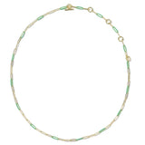 A delicate gold paperclip chain necklace with alternating light green inlay segments, displayed on a clean white background.