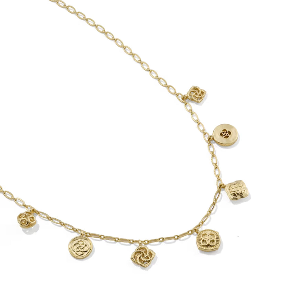 A delicate gold chain necklace featuring multiple small, textured pendant charms in various shapes, displayed on a clean white background.