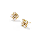 A pair of gold stud earrings with white pearl-like floral clusters and small clear stones, shown on a clean white background.
