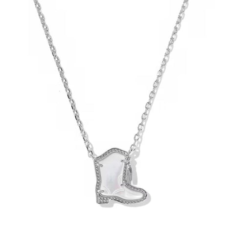 A silver-toned necklace featuring a cowboy boot pendant with a white iridescent inlay and small clear stones along the edges, shown against a plain white background.