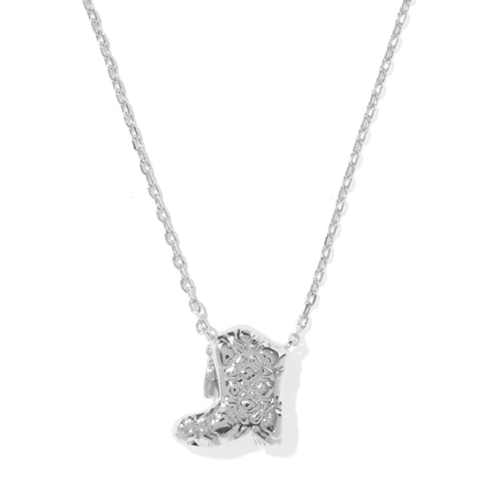 A silver necklace featuring a small boot-shaped pendant paved with clear stones, shown against a plain white background.