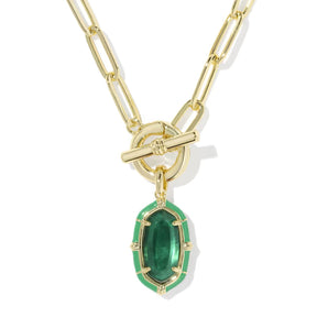 A gold paperclip chain necklace with a toggle clasp and a dangling green marquise-shaped gemstone pendant, shown on a clean white background.