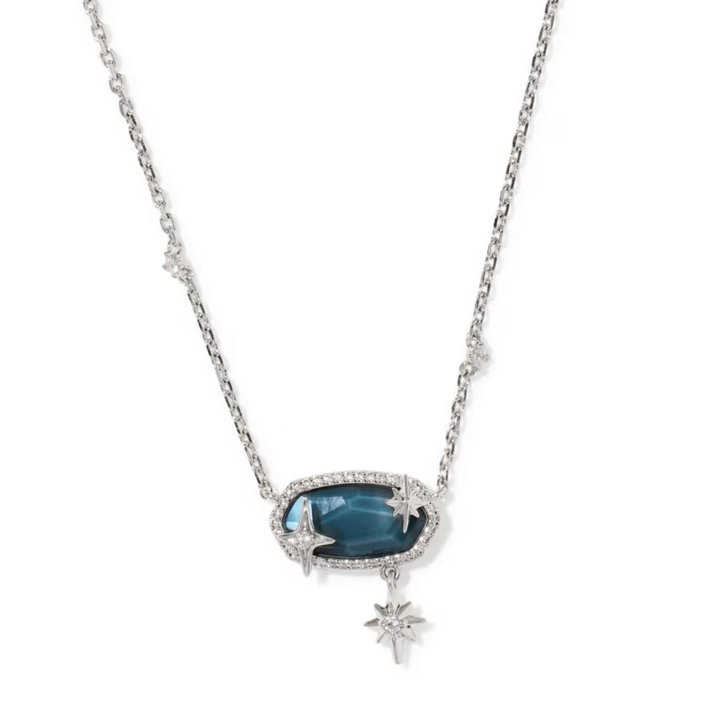 A silver-toned celestial necklace featuring a central oval pendant with a deep blue cabochon stone surrounded by small clear stones, accented with three dangling star charms, shown on a plain white background.