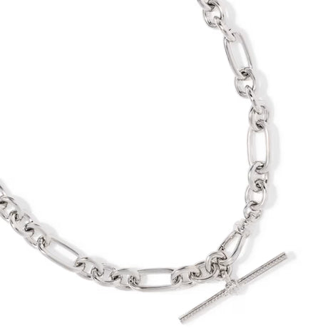 A silver-toned chain necklace featuring a mix of classic Figaro and oval links, with a polished T-bar clasp adorned with a small clear crystal, shown on a clean white background.