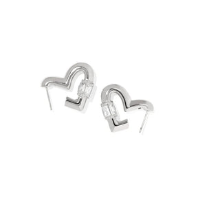 A pair of silver-toned geometric earrings with a curved, open heart-like shape and clear rectangular gemstones, shown on a plain white background.