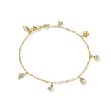 Gold bracelet with various charms on a white background