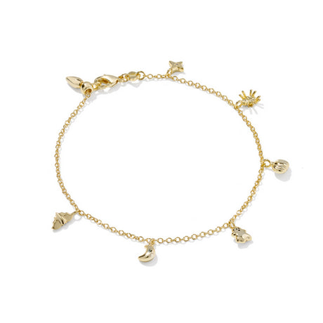 Gold bracelet with various charms on a white background