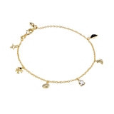Gold bracelet with various charms on a white background