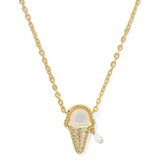 A gold chain necklace featuring an ice cream cone pendant with a white mother-of-pearl scoop and a small dangling white bead, shown on a plain white background.