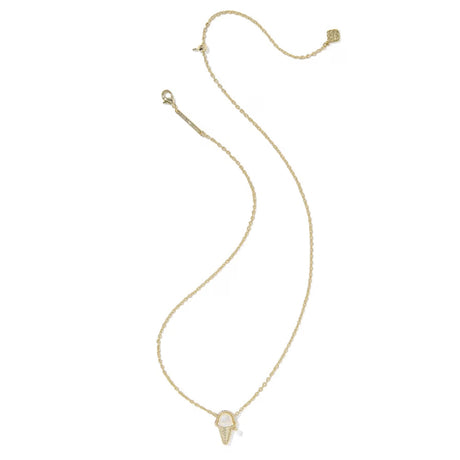 A delicate gold chain necklace featuring a small pendant with a white inlay, displayed on a clean white background.
