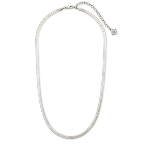 A silver-toned snake chain necklace with a small circular engraved charm, displayed on a clean white background.
