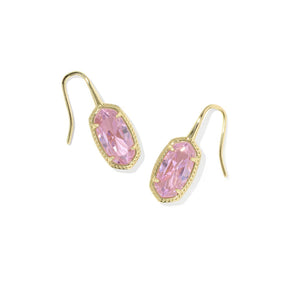 A pair of gold drop earrings featuring marquise-cut pink gemstones in a bezel setting with a delicate milgrain border, shown on a plain white background.