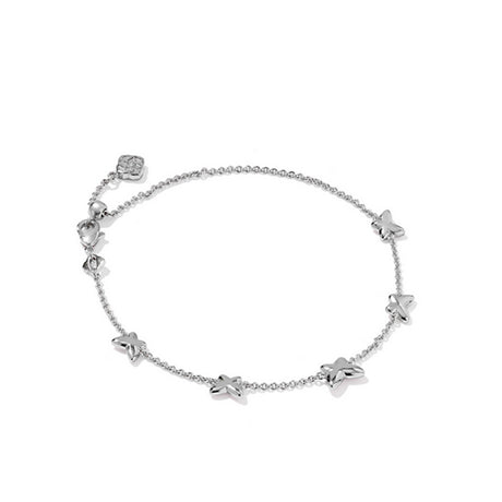 Silver bracelet with butterfly-shaped charms on a white background