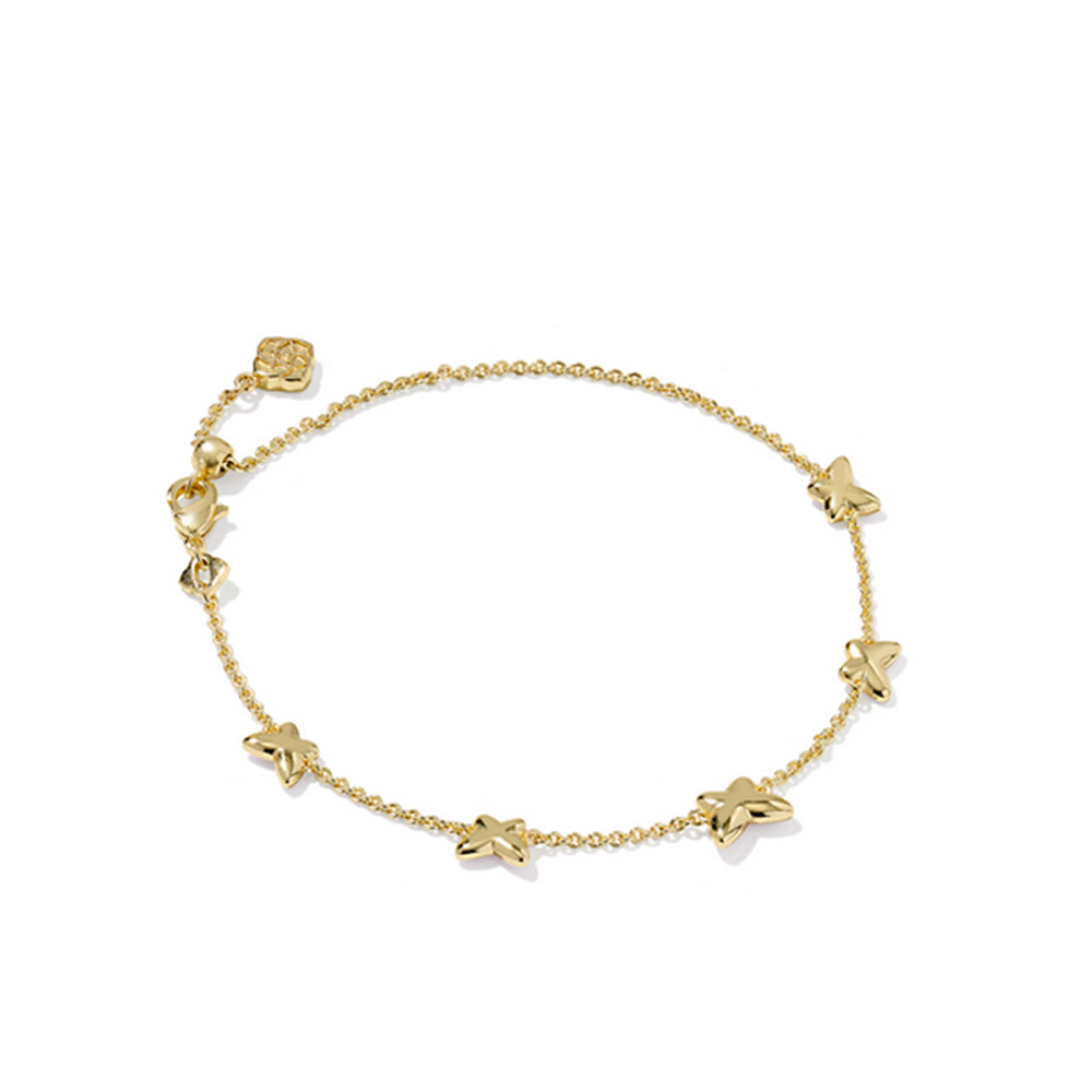 Gold bracelet with butterfly-shaped charms on a white background