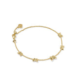 Gold bracelet with butterfly-shaped charms on a white background