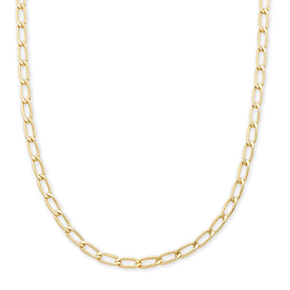 A gold Figaro chain necklace with elongated oval links, displayed in a curved shape against a solid white background.