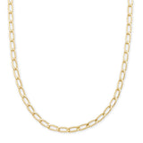 A gold Figaro chain necklace with elongated oval links, displayed in a curved shape against a solid white background.