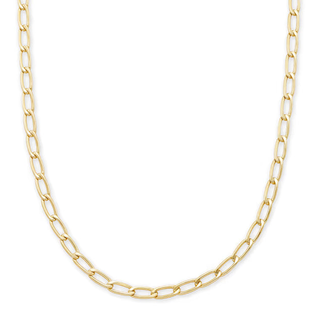 A gold Figaro chain necklace with elongated oval links, displayed in a curved shape against a solid white background.