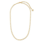 A gold chain necklace with elongated oval links, a lobster clasp, an adjustable extender chain, and a small decorative gold charm, displayed on a clean white background.