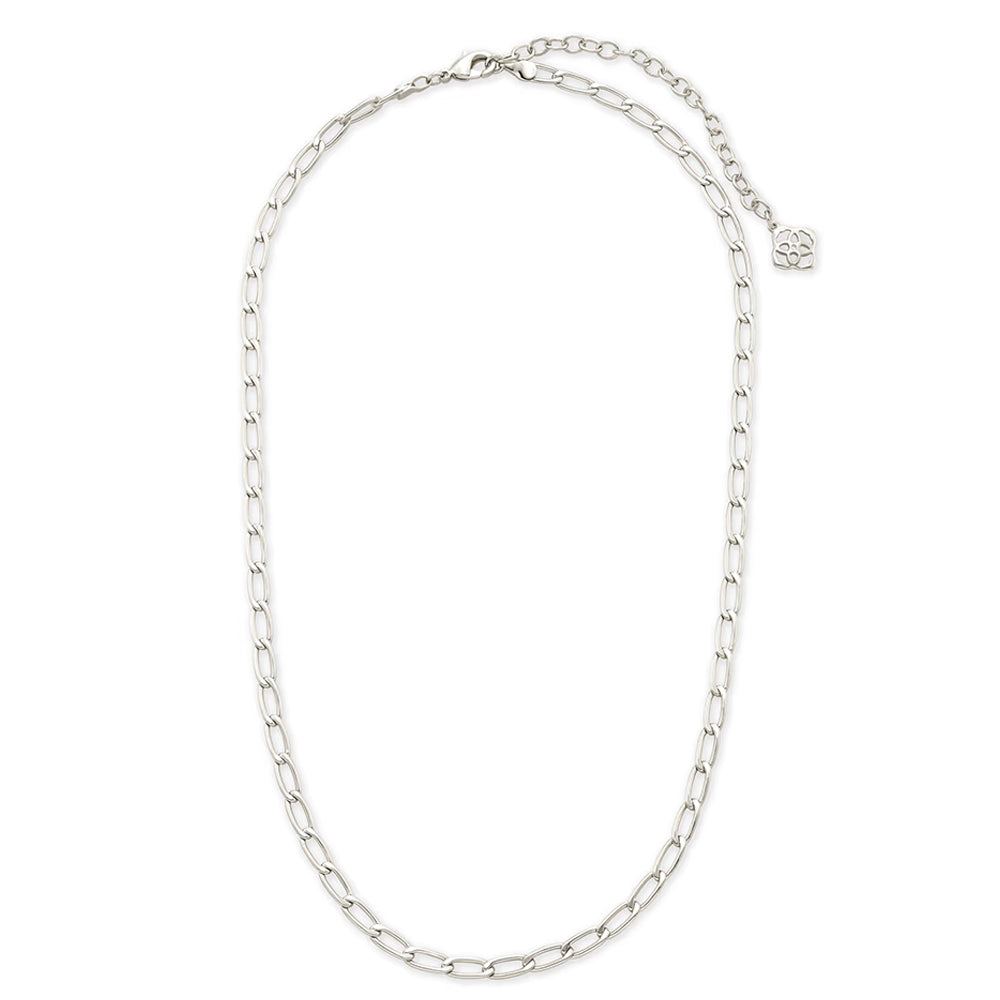 A silver-toned chain necklace with a small round logo charm, displayed on a clean white background.