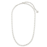A silver-toned chain necklace with a small round logo charm, displayed on a clean white background.