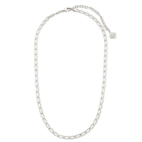A silver-toned chain necklace with a small round logo charm, displayed on a clean white background.