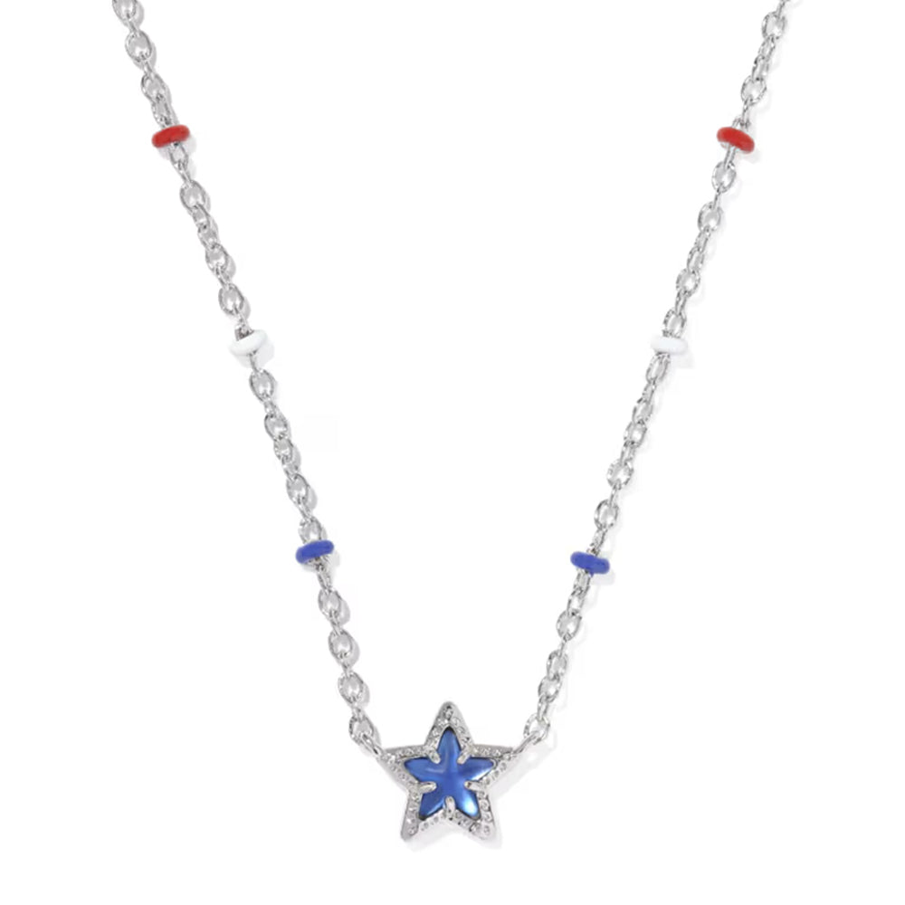 A silver-toned star pendant necklace with a blue inlay, accented by small red and blue beads on a white background.