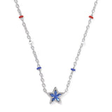 A silver-toned star pendant necklace with a blue inlay, accented by small red and blue beads on a white background.