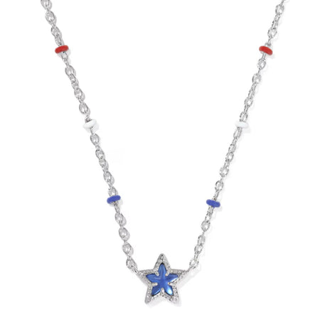 A silver-toned star pendant necklace with a blue inlay, accented by small red and blue beads on a white background.