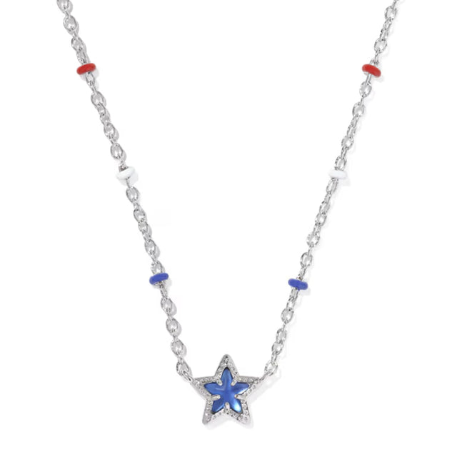 A silver-toned star pendant necklace with a blue inlay, accented by small red and blue beads on a white background.
