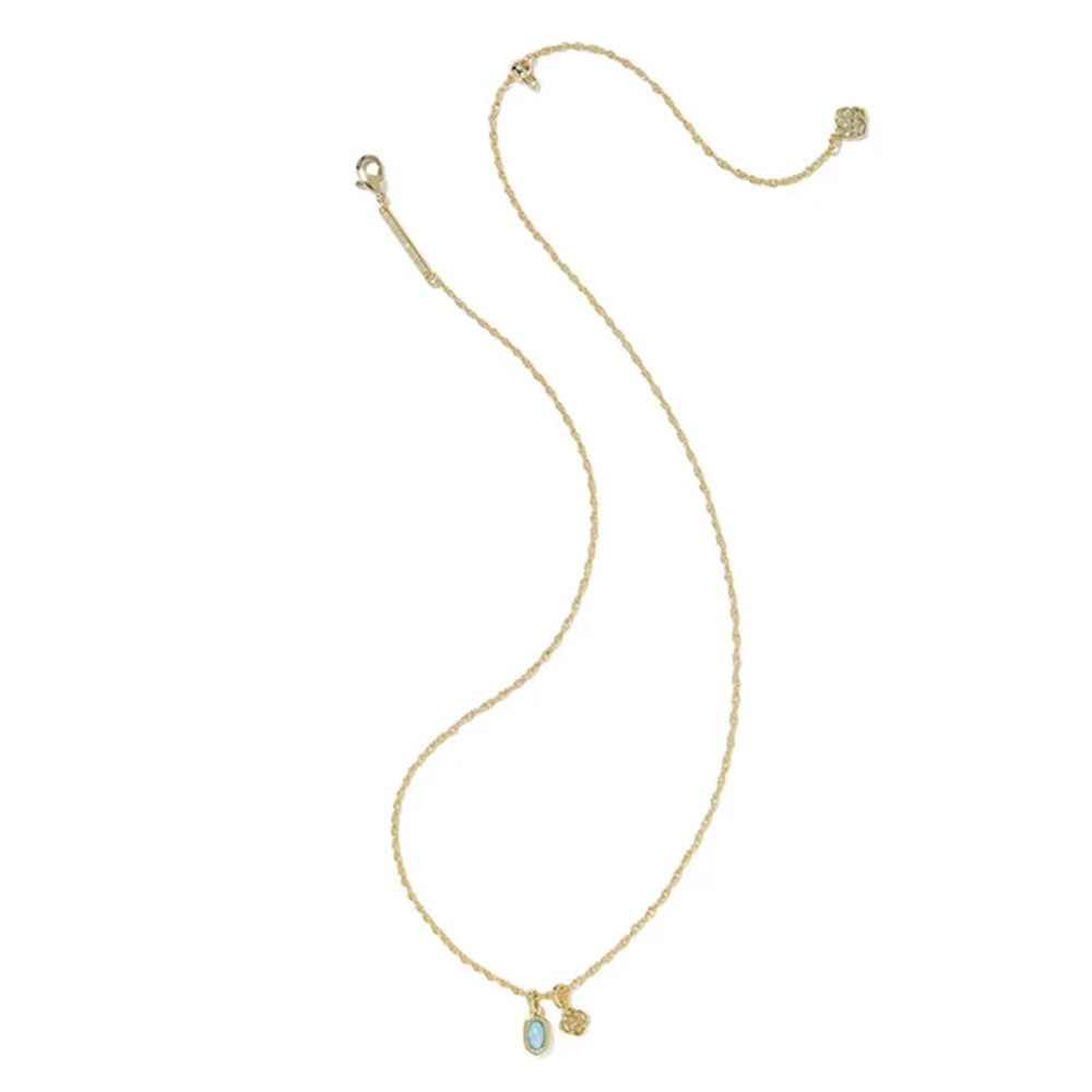 A delicate yellow gold chain necklace featuring a small oval light blue stone pendant and a tiny gold charm, displayed on a clean white background.