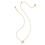 A delicate yellow gold chain necklace featuring a small oval light blue stone pendant and a tiny gold charm, displayed on a clean white background.
