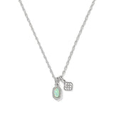 A silver chain necklace featuring an oval pendant with a light green opal-like center surrounded by small clear stones, alongside a small geometric charm, shown on a plain white background.