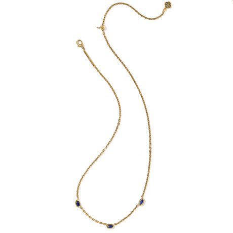 Gold necklace with blue gemstones on a white background