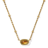 Gold necklace with a tiger's eye pendant on a white background